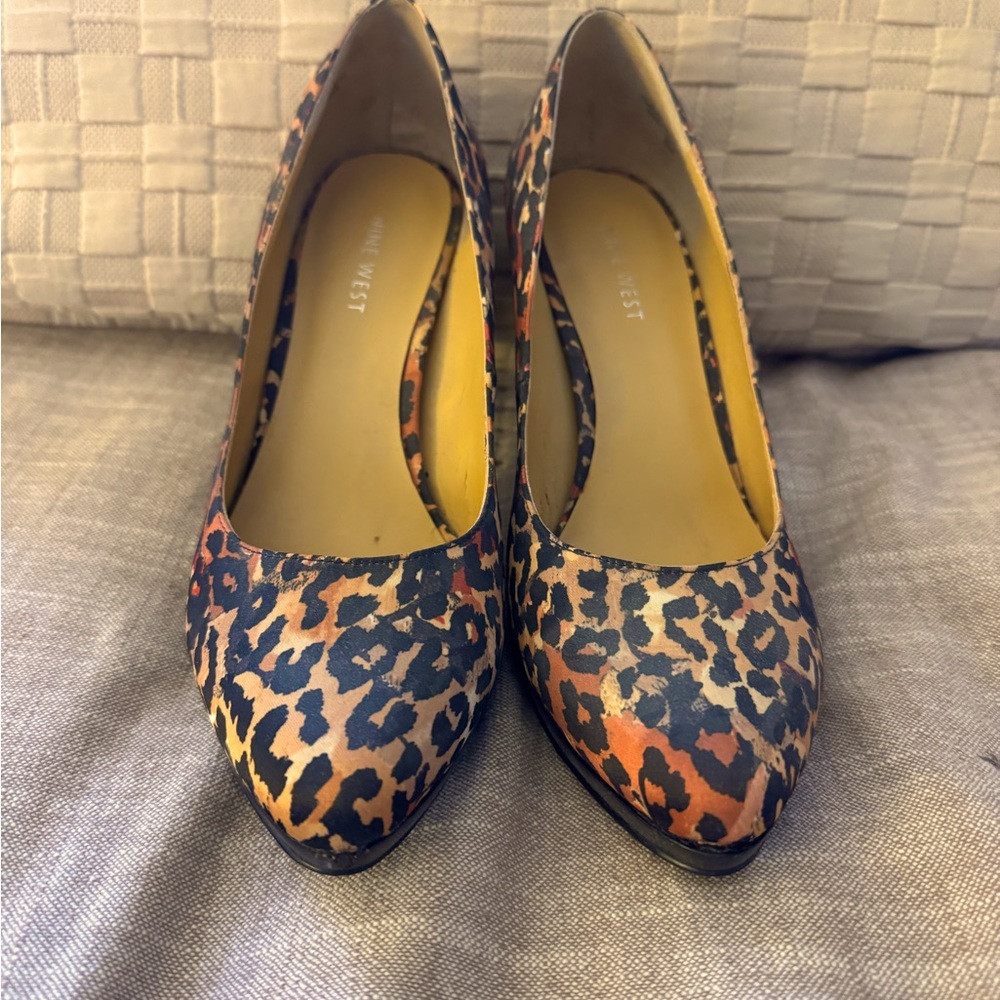 LIKE NEW NINE WEST CHEETAH PRINT PUMPS. SIZE 7 1/2. 4 INCH HEEL. WORN ONCE.